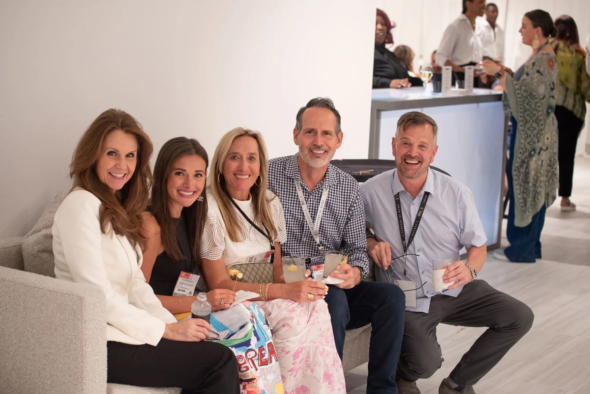 Bernhardt sales associate Jana White (left) enjoys time with a group from Birmingham, AL, design firm Olivieri  Harris Interiors.
