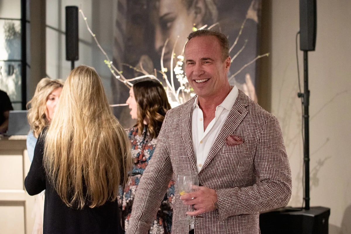 CEO Alex Bernhardt, Jr. smiles after an impromptu sing-along with employees to a song supplied by guest DJ, DJ  RaQuest, who kept the party pumping.