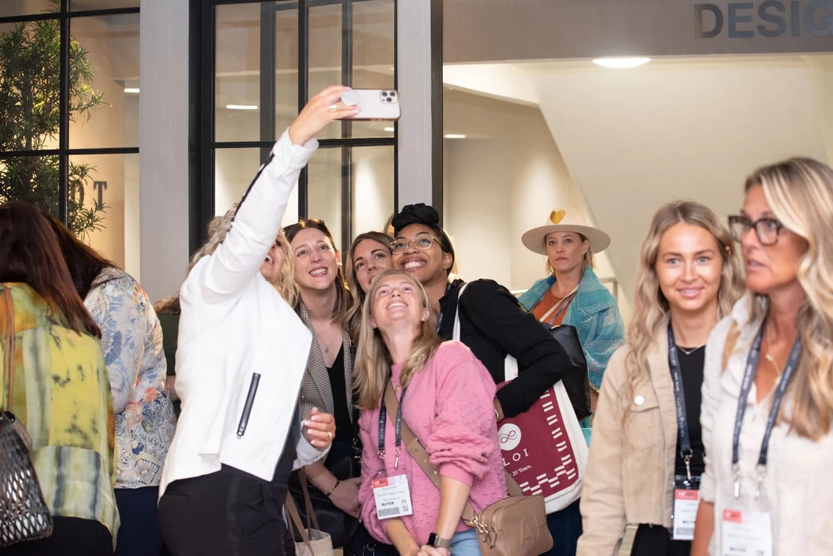 Bernhardt sales associate Jana White (left) enjoys time with a group from Birmingham, AL, design firm Olivieri  Harris Interiors.