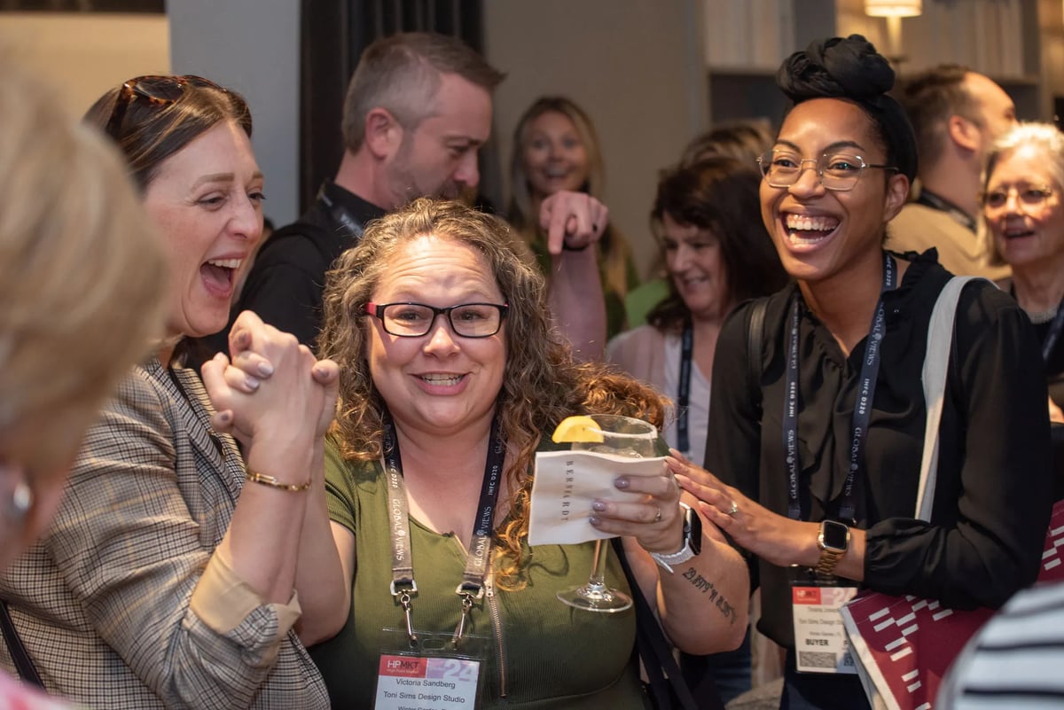 Victoria Sandberg (center) with Toni Sims Design Studio in Winter Garden, FL, celebrates with friends and  associates after hearing her name drawn for the trip to Mexico.