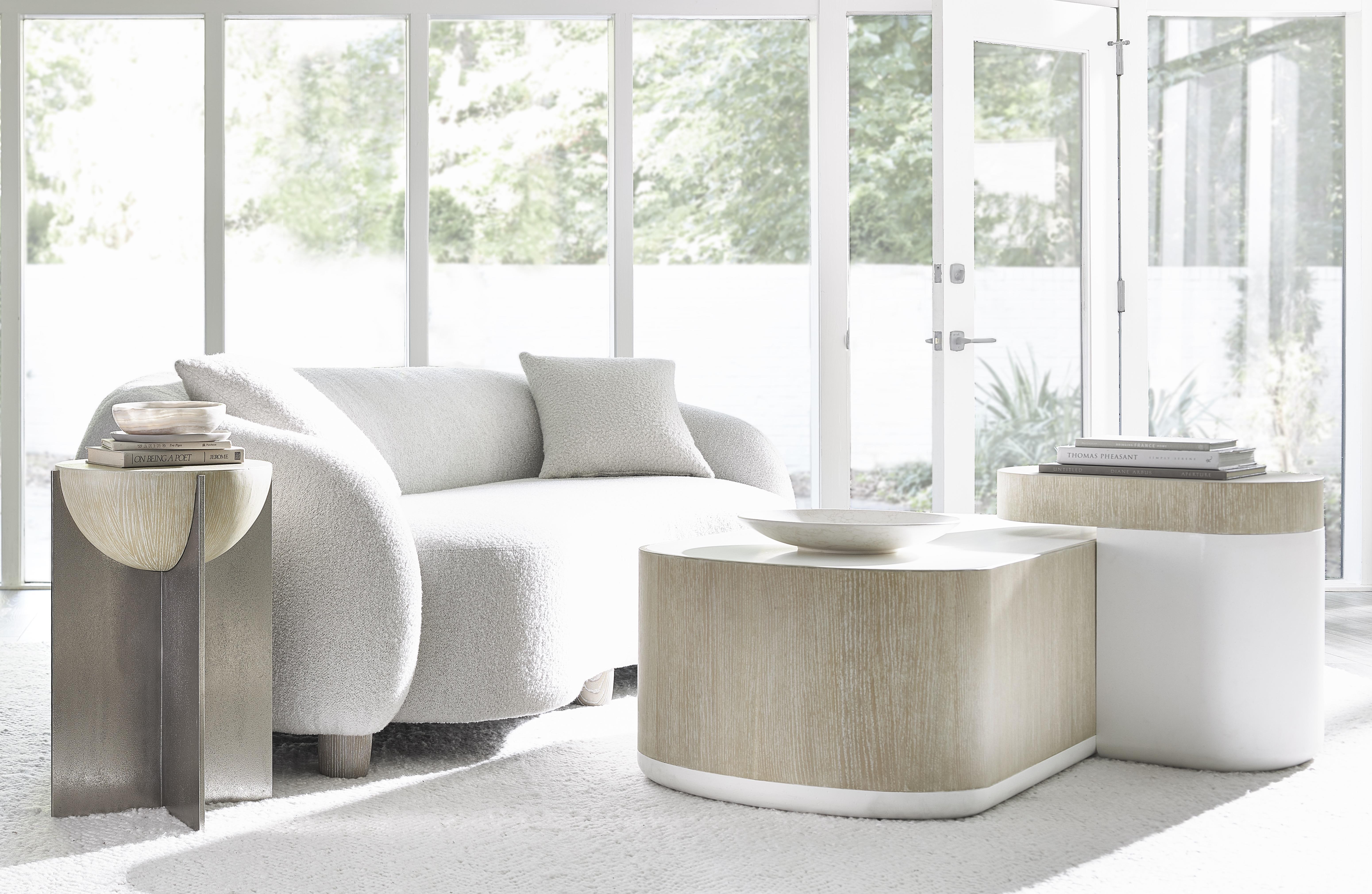 Explore the sculptural beauty of curved silhouettes and fluid form in a curated selection of Bernhardt accent tables.